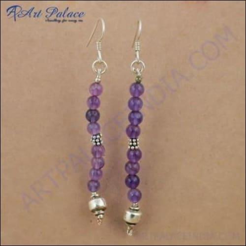Trendy long earrings featuring amethyst gemstones set in silver, showcasing elegance and style.
