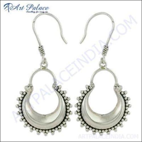 Trendy celeb-style plain silver earrings showcasing a sleek and elegant design, perfect for any occasion.