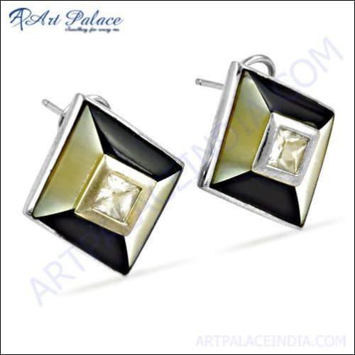 Trendy silver earrings featuring cubic zirconia inlay, showcasing a stylish and elegant design.