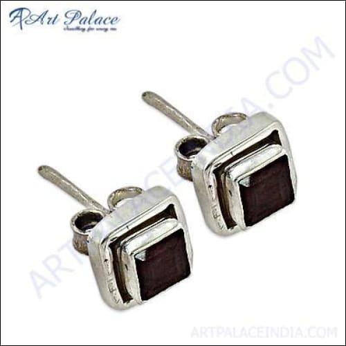 Trendy garnet gemstone silver stud earrings showcasing elegant design and craftsmanship.