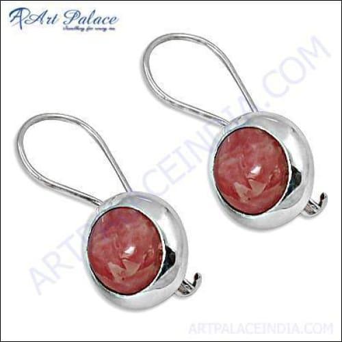 Trendy rhodochrosite gemstone silver earrings showcasing unique pink and white patterns, elegantly designed for stylish wear.