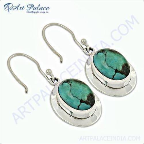 Trendy turquoise gemstone silver earrings showcasing intricate design and vibrant color, perfect for stylish occasions.