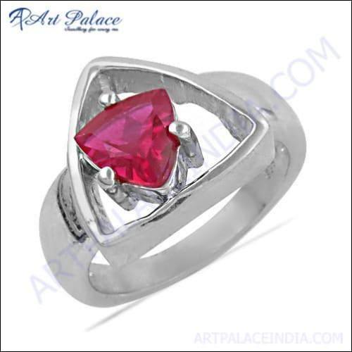 Triangle style silver ring featuring a vibrant pink cubic zirconia gemstone, showcasing elegant design and craftsmanship.
