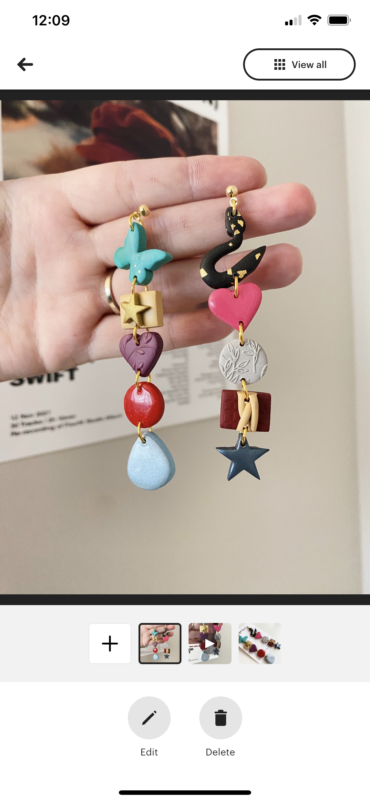 A pair of handmade polymer clay earrings inspired by TS, featuring vibrant colors and unique patterns, crafted in Winnipeg, Canada.