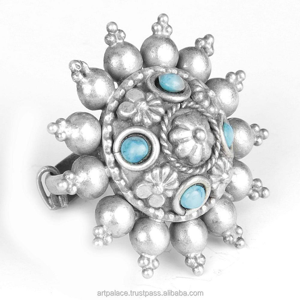 Turquoise gemstone oxidized 925 silver ring showcasing intricate design and vibrant color.