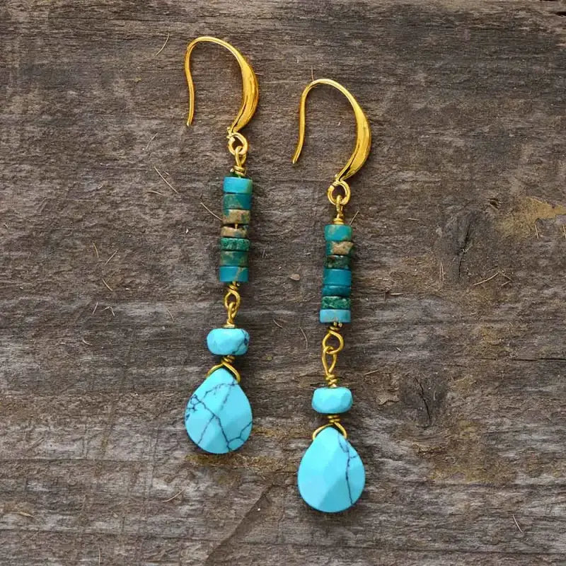 A pair of elegant Turquoise Jasper Earrings featuring vibrant semi-precious stones in a bohemian design, perfect for enhancing any outfit.