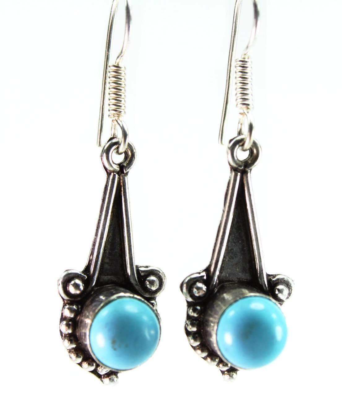Elegant turquoise round stone earrings with silver tone accents, featuring a lengthy drop design.