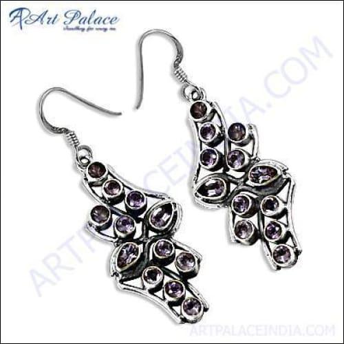 A pair of elegant silver earrings featuring high-quality amethyst gemstones, showcasing a stunning purple hue.