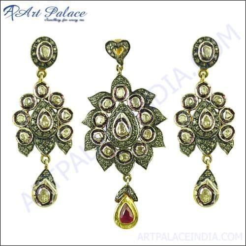 A luxurious gold plated diamond and ruby silver earrings and pendant set, showcasing intricate Victorian design and sparkling gemstones.