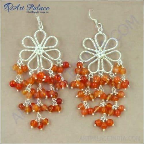 Elegant silver earrings featuring unique carnelian gemstones, showcasing intricate craftsmanship and vibrant colors.
