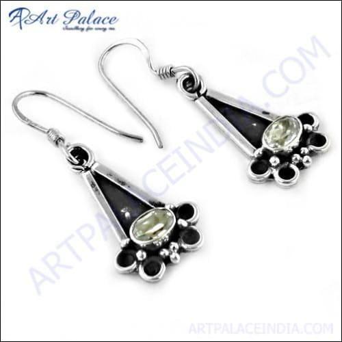 Unique feminine designer silver earrings featuring sparkling cubic zirconia gemstones, showcasing elegant craftsmanship and modern design.