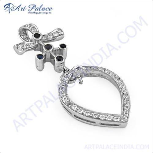 A unique feminine silver pendant featuring cubic zirconia and iolite, showcasing intricate design and sparkling gemstones.