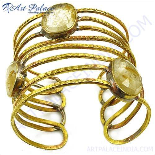 A stunning golden rutile gemstone bangle featuring vibrant yellow gemstones, showcasing intricate craftsmanship and elegant design.
