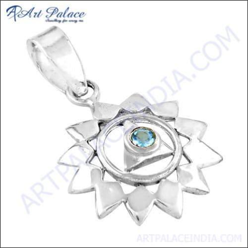 A beautiful blue cubic zirconia gemstone set in an elegant silver pendant, perfect for parties and special occasions.