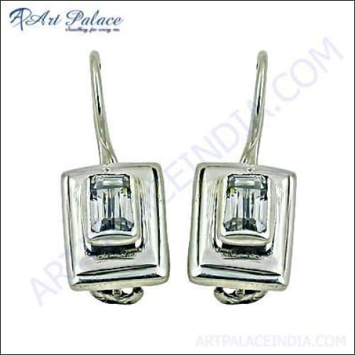A pair of elegant handmade silver earrings adorned with sparkling cubic zirconia, showcasing a simple and solid design.