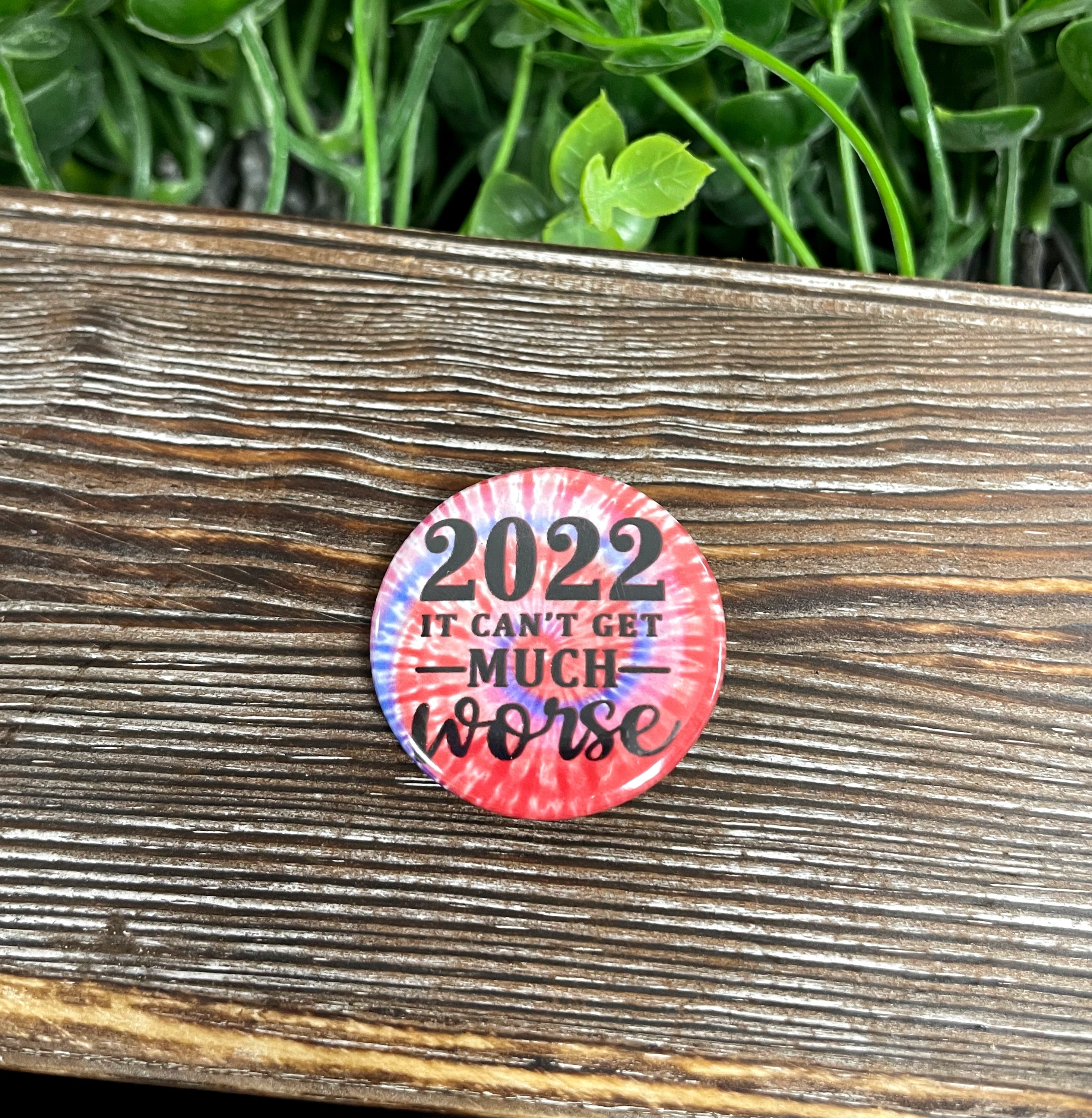 2022 It Can't Get Much Worse graphic art button pin, 1.25 inches, featuring a vibrant red tie design.