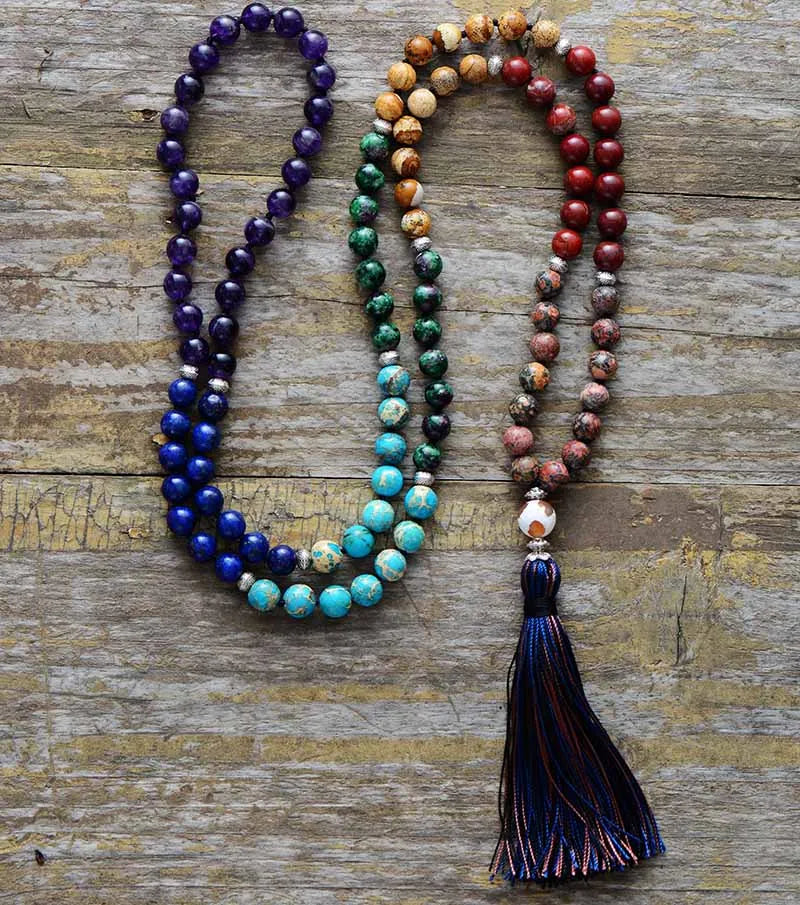 A handmade 7 Chakra Mala Tassel Necklace featuring various natural healing stones including Jasper and Turquoise, designed for spiritual balance.