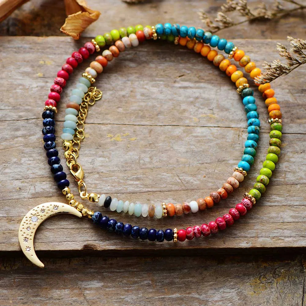 7 Chakra Moon Necklace featuring colorful chakra stones and a moon pendant, perfect for bohemian style.