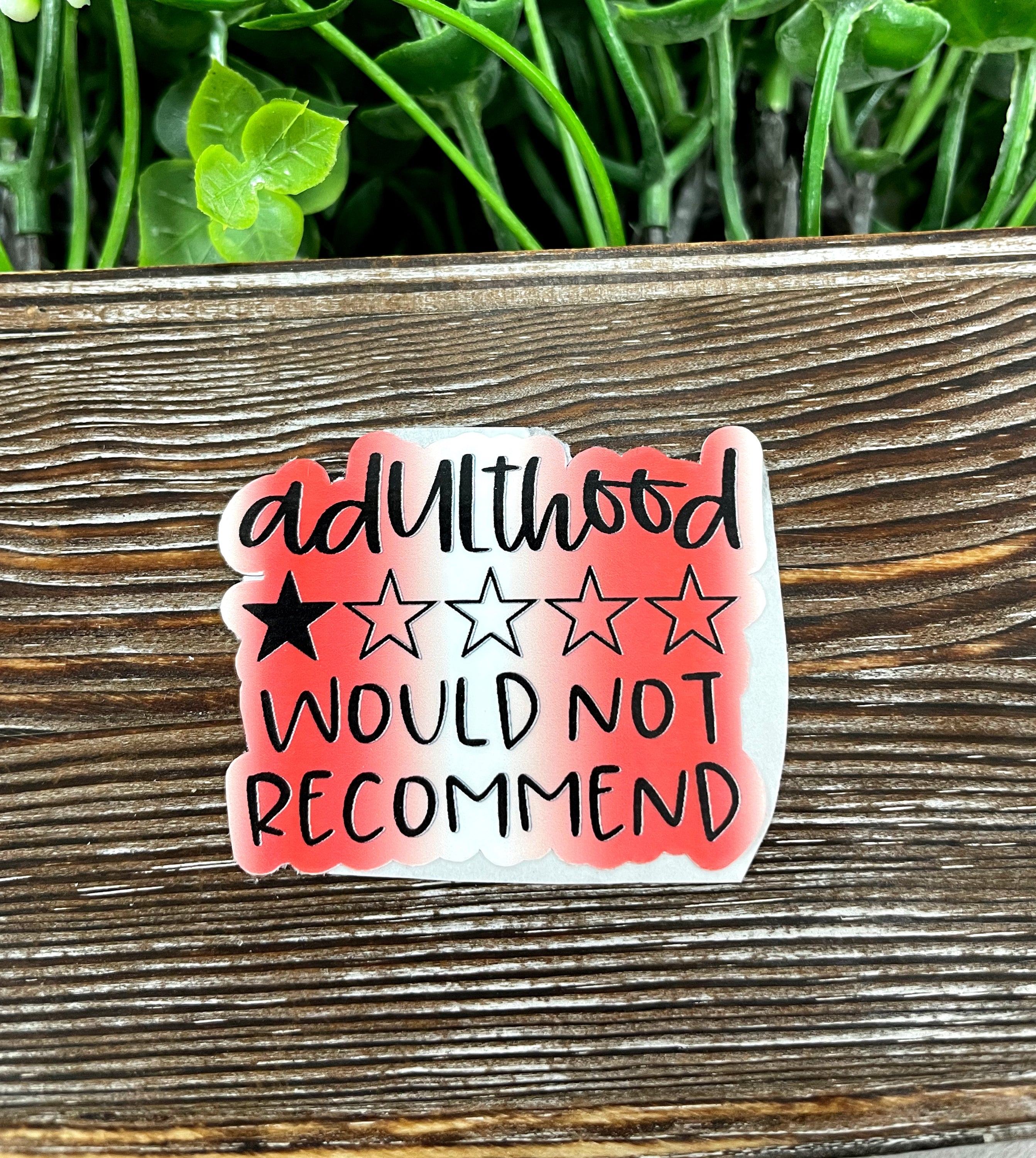 Adulthood Rating One Star Die Cut Sticker on a smooth surface, showcasing vibrant colors and unique graphic art design.