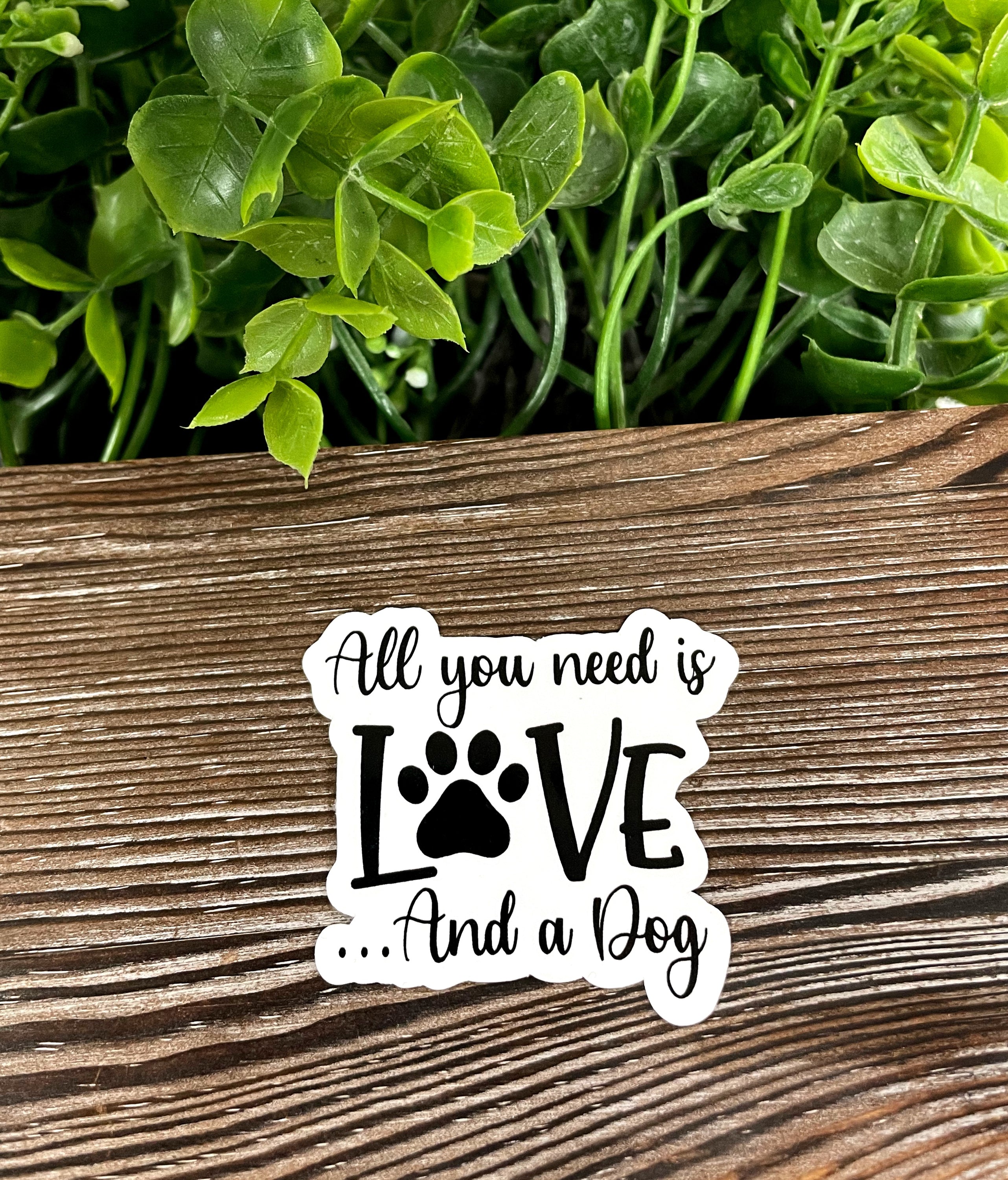 All You Need is Love and a Dog sticker featuring vibrant colors and a playful design, perfect for personalizing various surfaces.