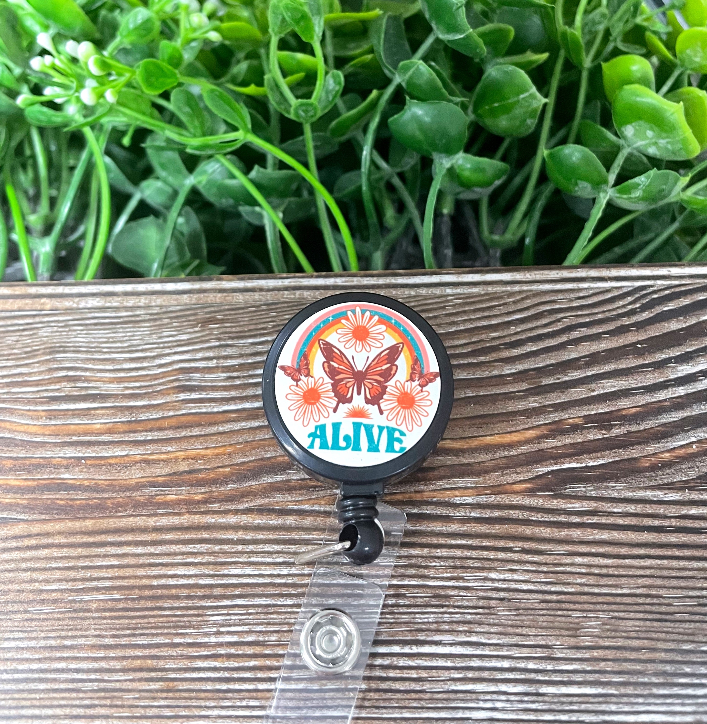 Alive Retro Butterfly retractable badge reel with a vibrant boho design, featuring a 24-inch extension cord and metal construction.