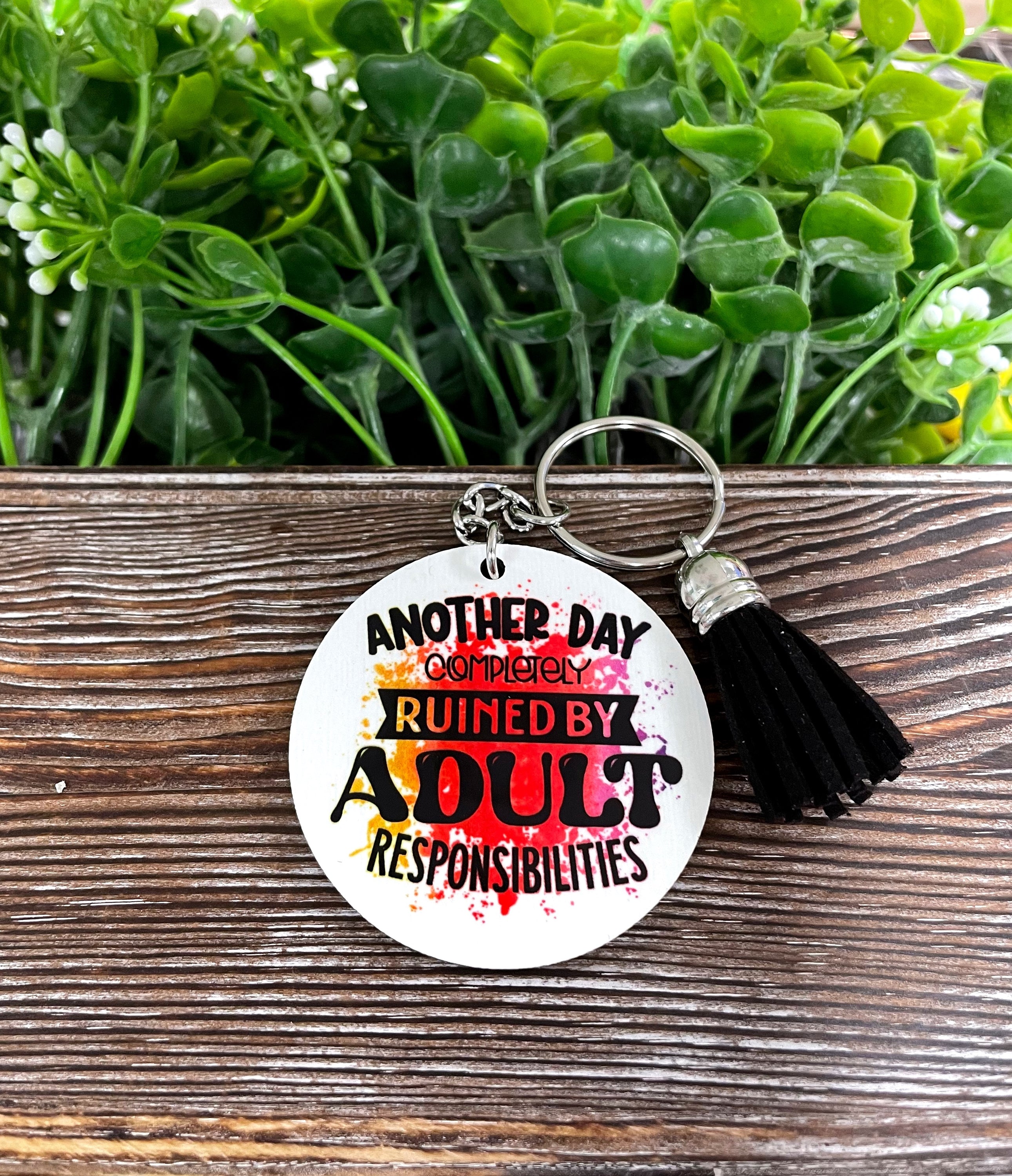 Lightweight MDF round keychain featuring a humorous design about adult responsibilities, perfect for personal use or gifting.