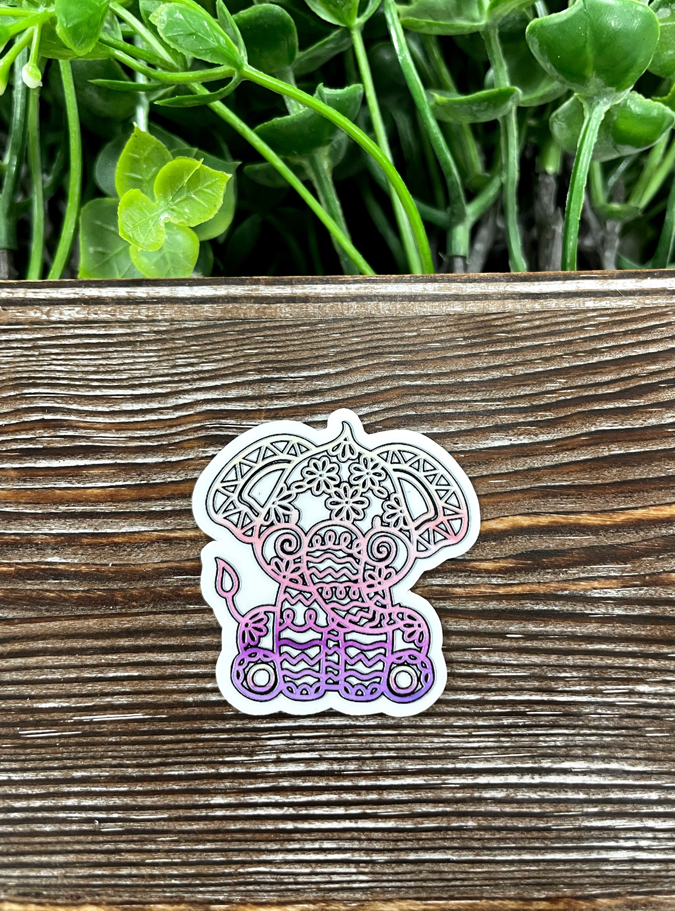 Colorful Baby Mandala Elephant Die Cut Sticker on a smooth surface, showcasing intricate mandala patterns.