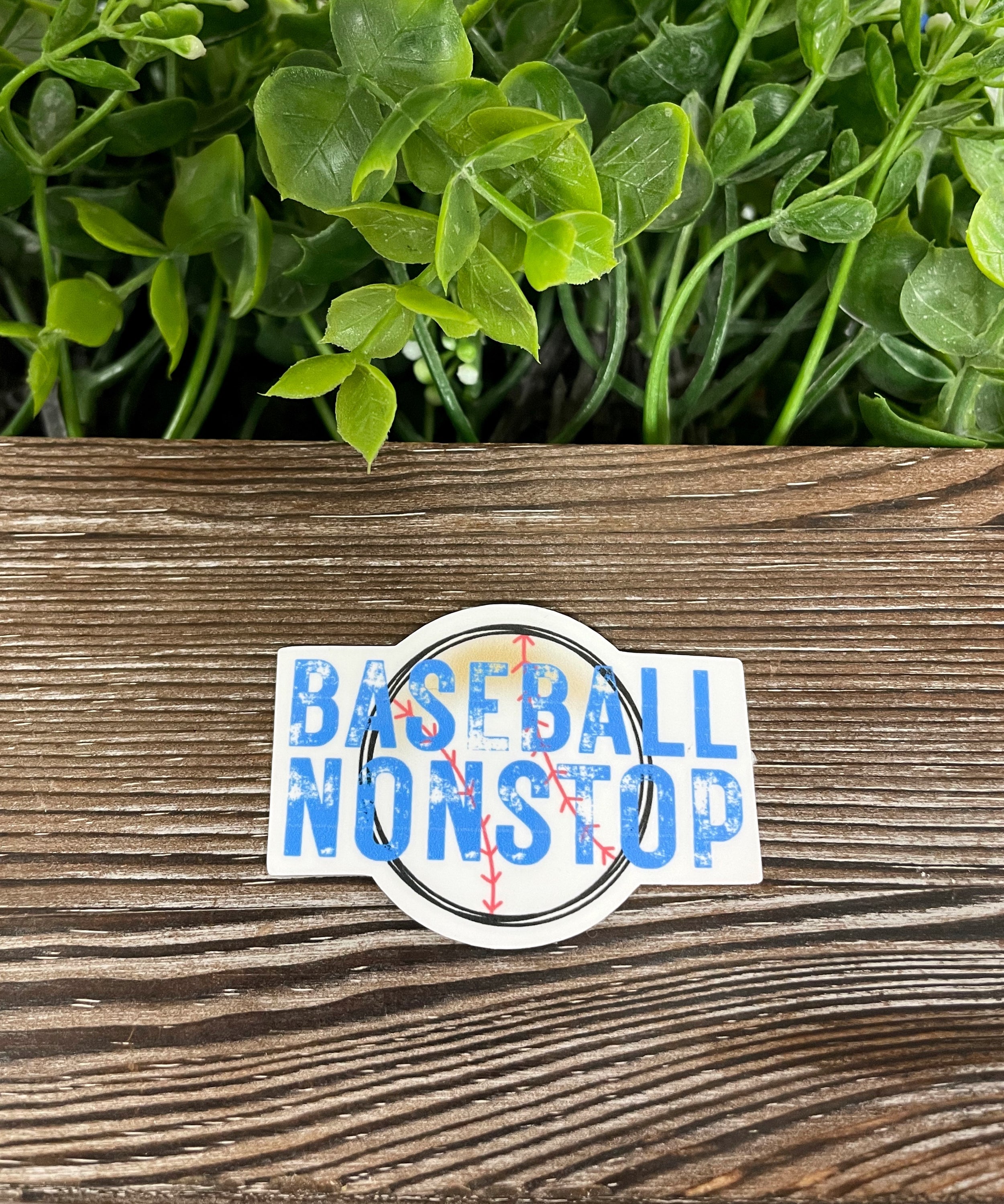 Colorful Baseball Nonstop die cut vinyl sticker on a smooth surface, showcasing its boho design and water-resistant feature.