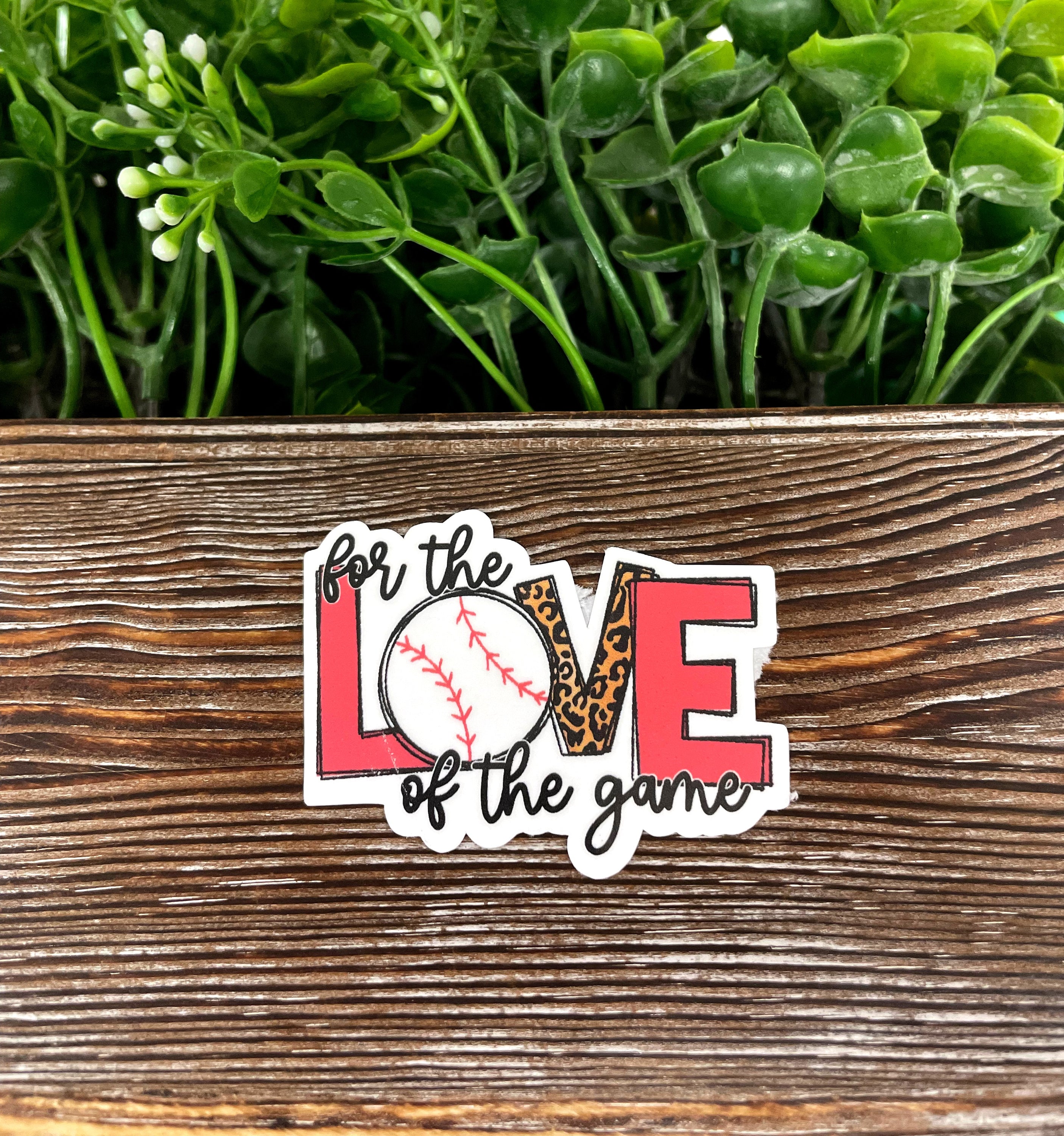 Colorful die cut vinyl baseball sticker on a smooth surface, showcasing a fun and boho design.