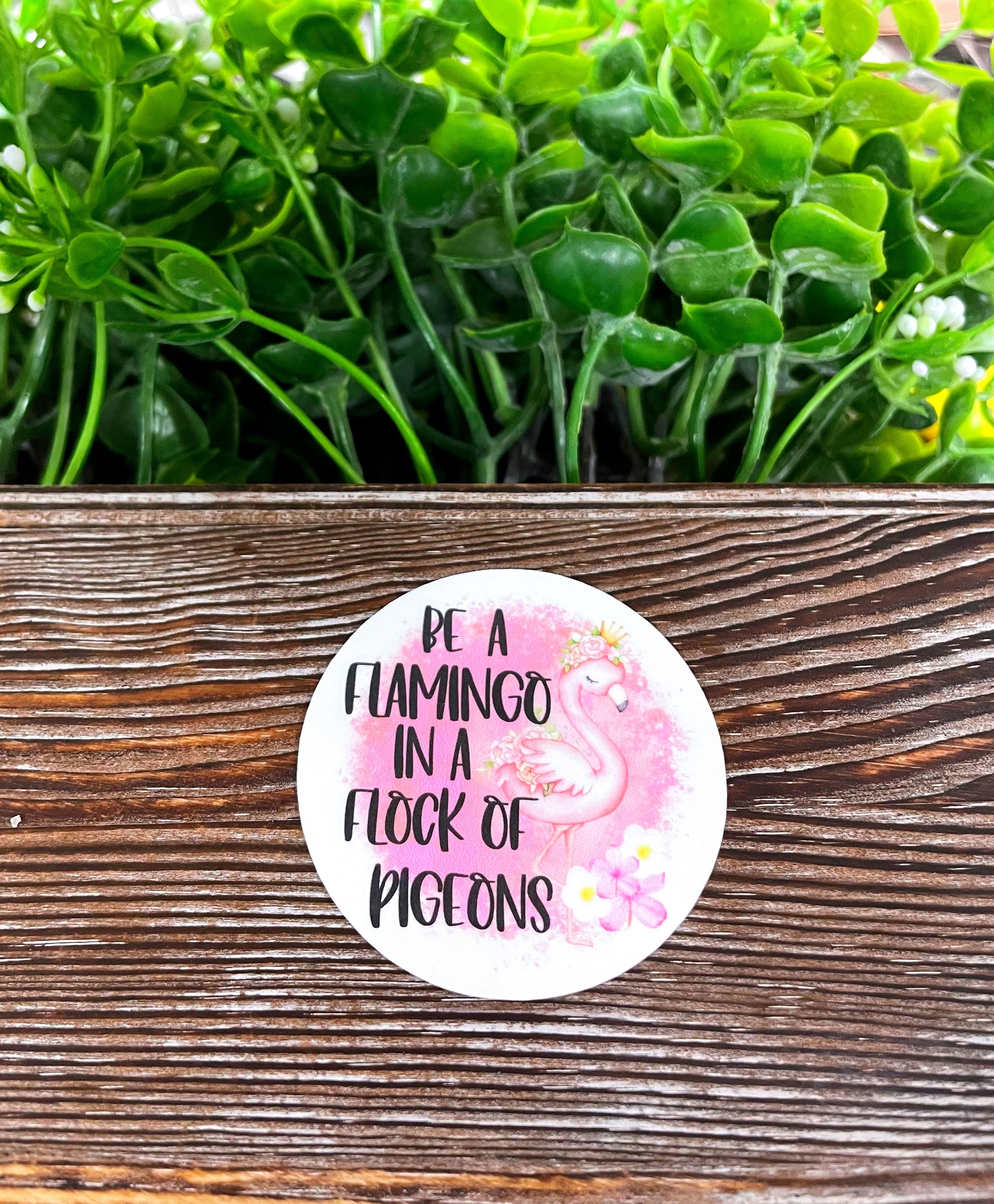 Colorful die cut vinyl sticker featuring a flamingo design, perfect for personalizing smooth surfaces.