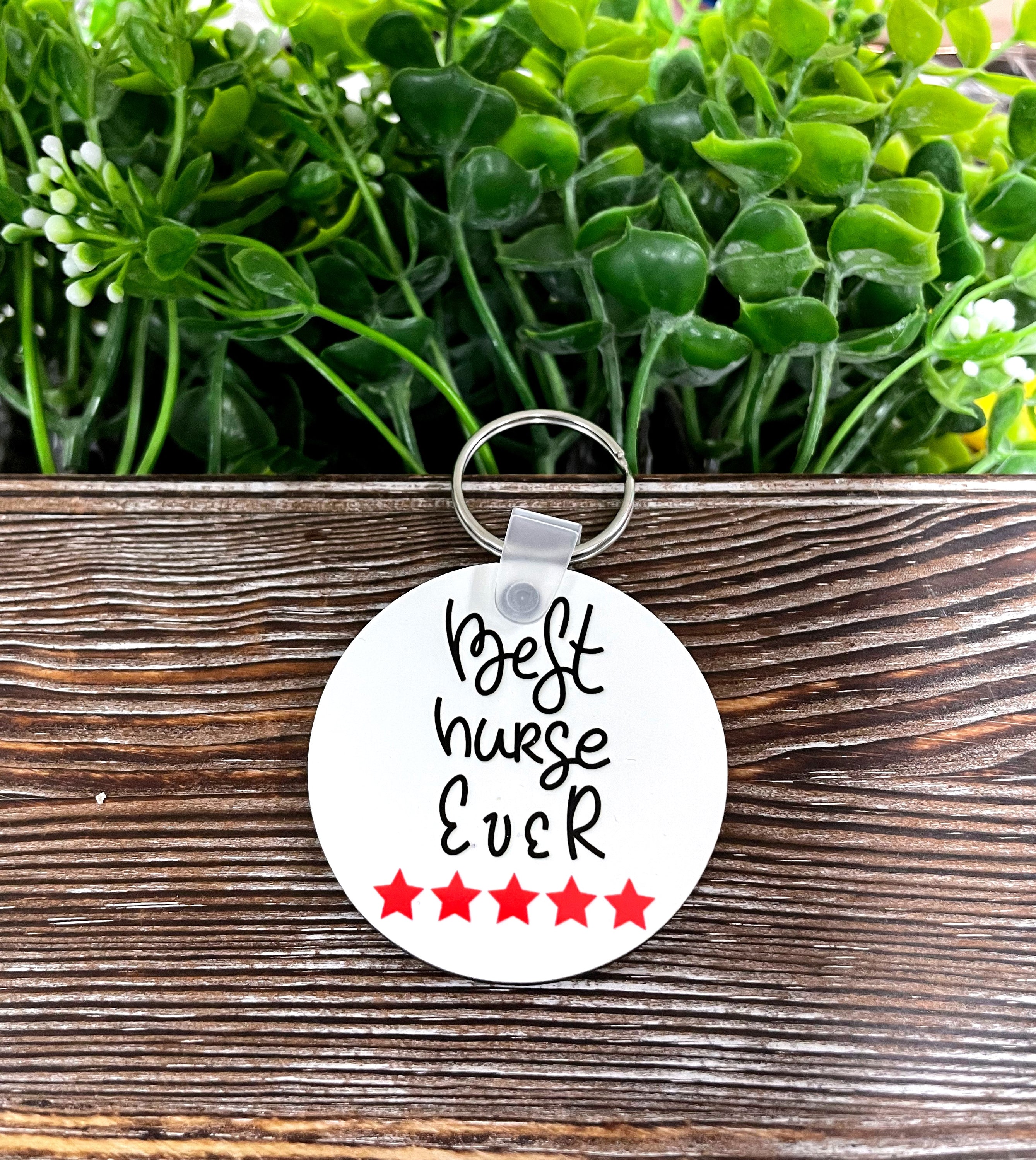 Best Nurse Ever MDF Round Keychain featuring vibrant colors and a fun design, perfect for nurses.