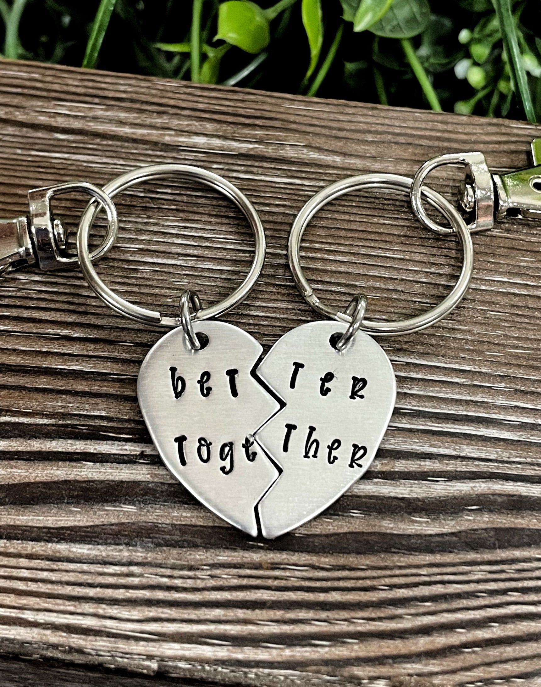 Better Together Broken Heart Key Chain Set featuring two interlocking heart pieces, hand-stamped with unique designs.