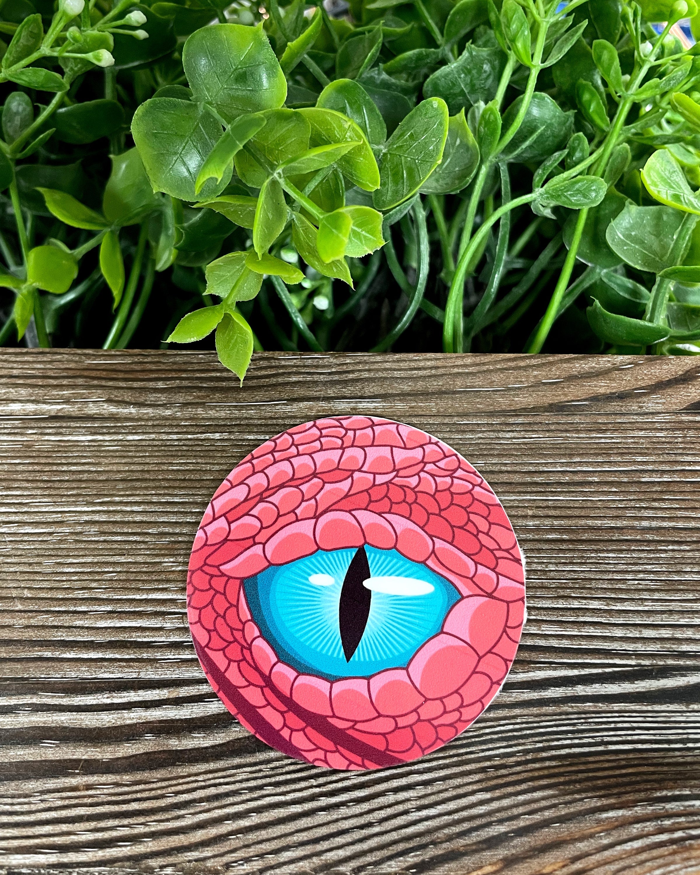 A vibrant Blue Dragon Eye die cut vinyl sticker with intricate details, showcasing a boho design, perfect for personalizing various surfaces.