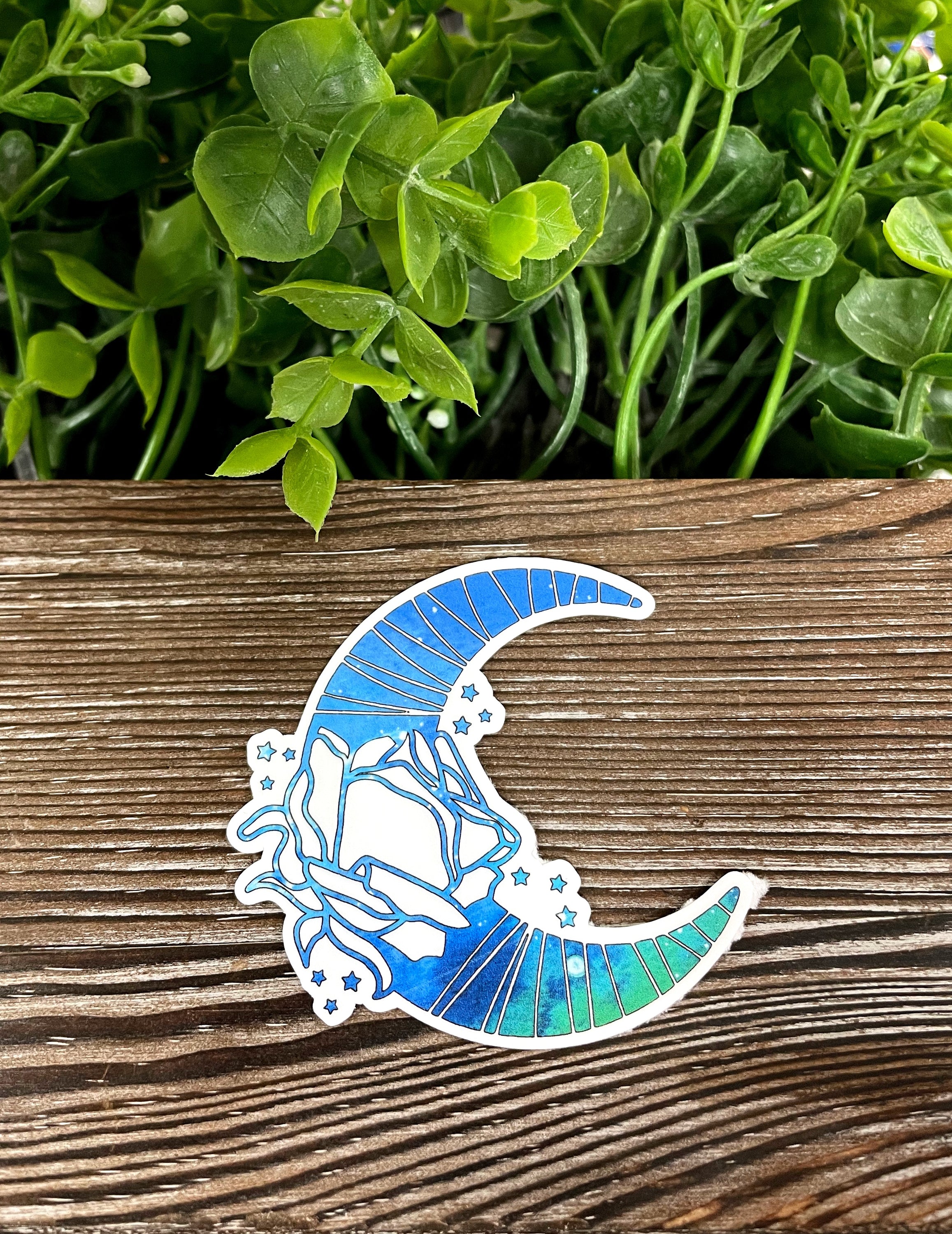 Blue Moon and Rose Sticker featuring vibrant colors and intricate design, perfect for personalizing various surfaces.
