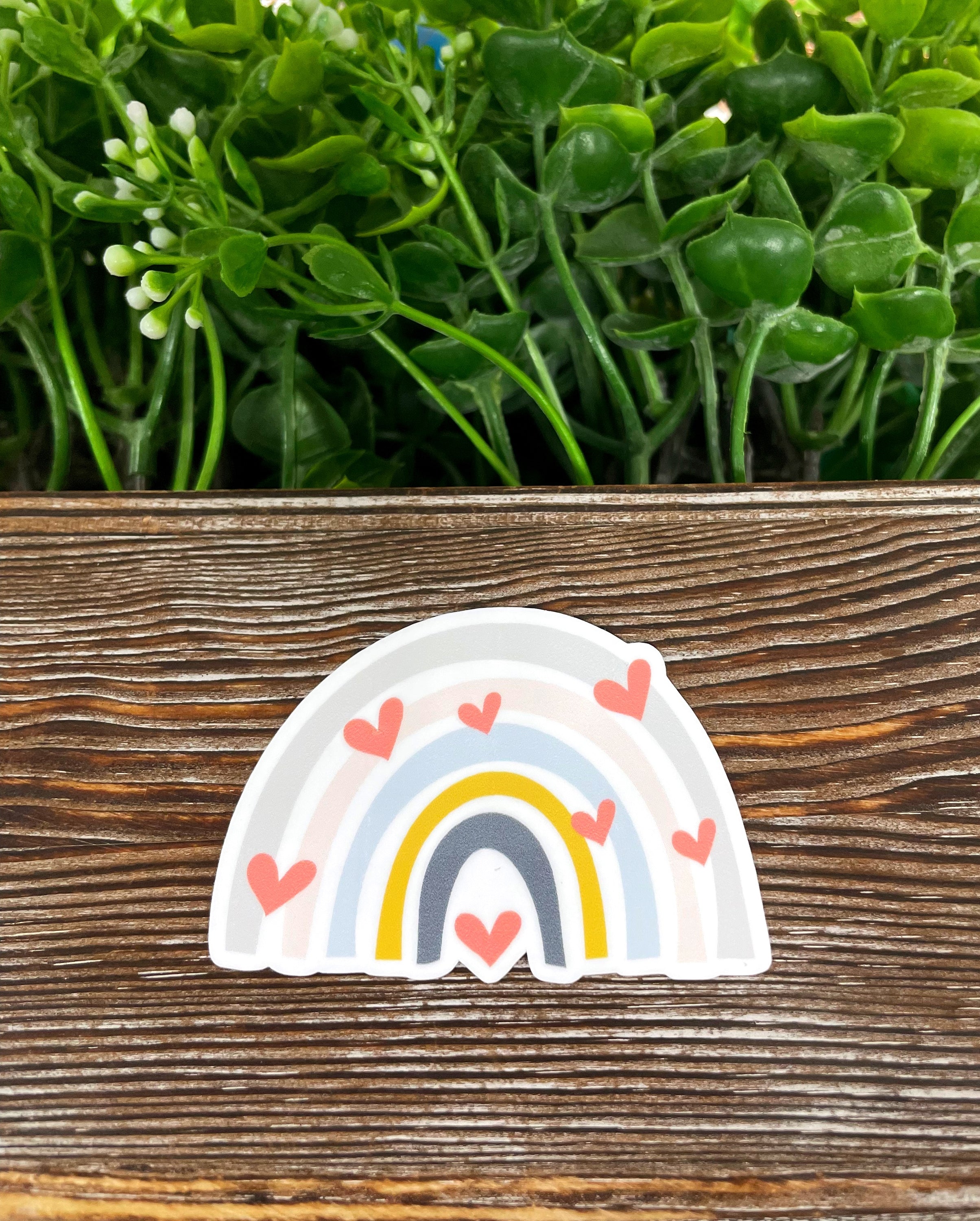 Bohemian Style Rainbow Die Cut Sticker featuring colorful hearts, perfect for personalizing various smooth surfaces.