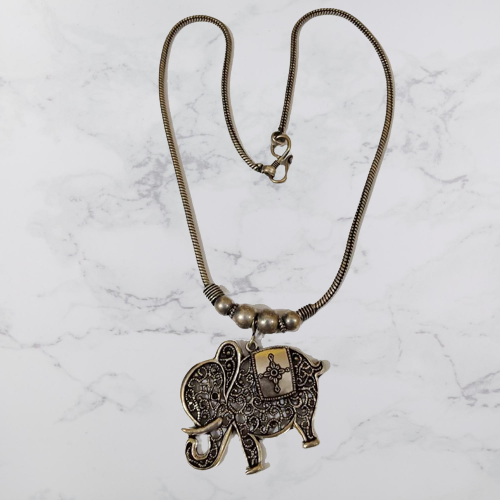 Bohotusk Elephant Cross Oxidised Silver Shield Pendant Necklace featuring an intricate elephant design on a silver shield pendant.