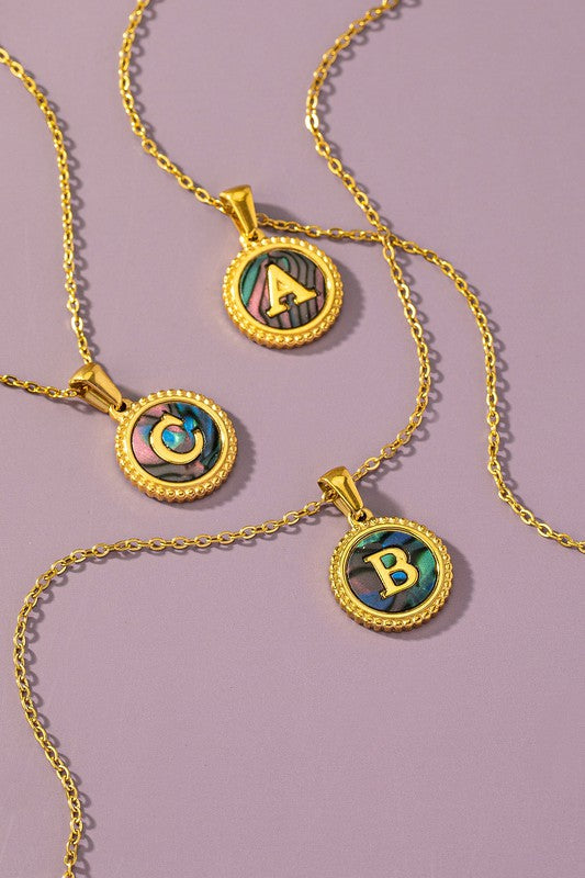 Brass abalone shell inlay initial pendant necklace with adjustable chain, showcasing vibrant colors and unique patterns.