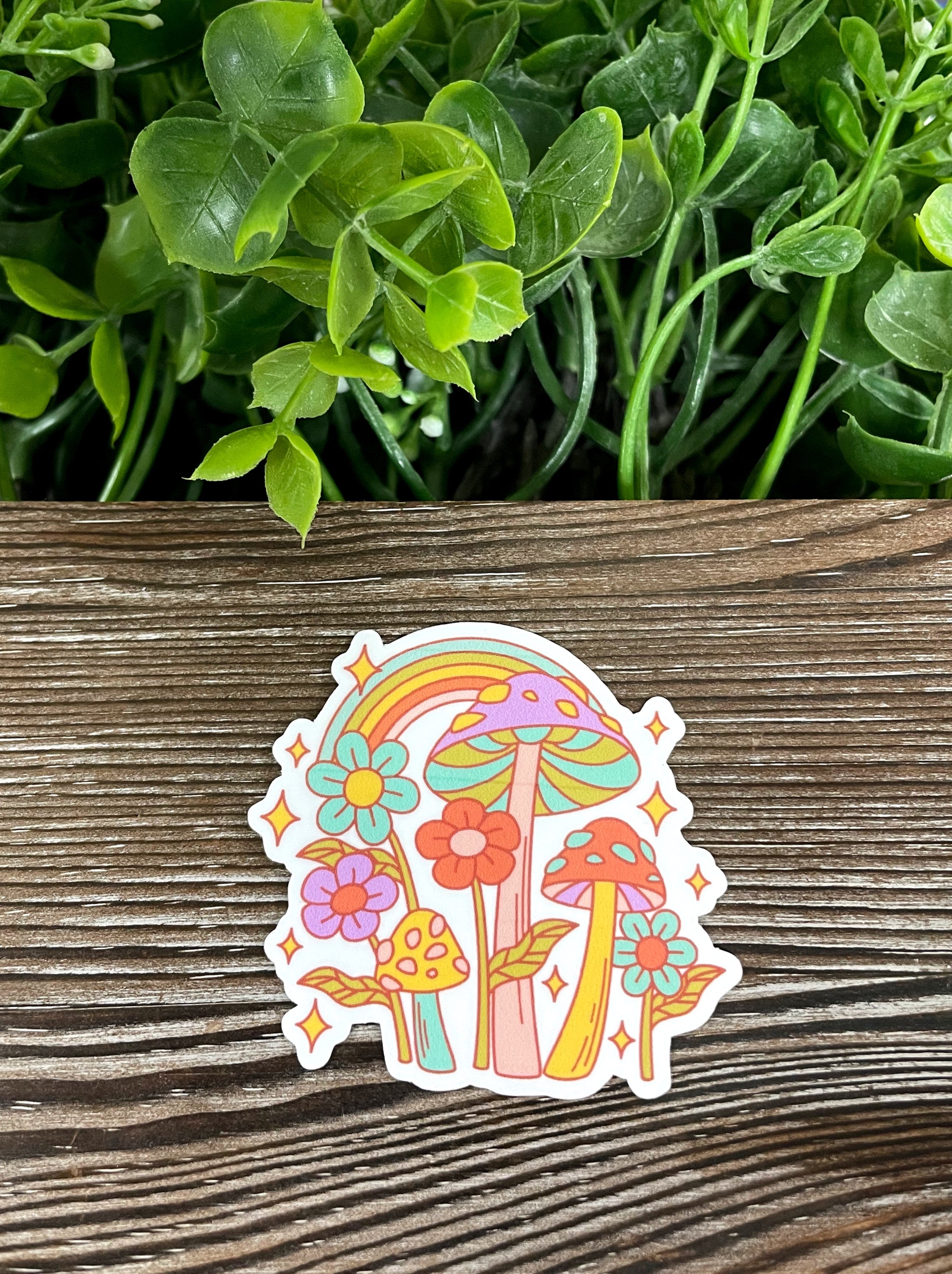 Bright colorful die cut vinyl stickers featuring neon mushrooms and flowers, perfect for personalizing items.