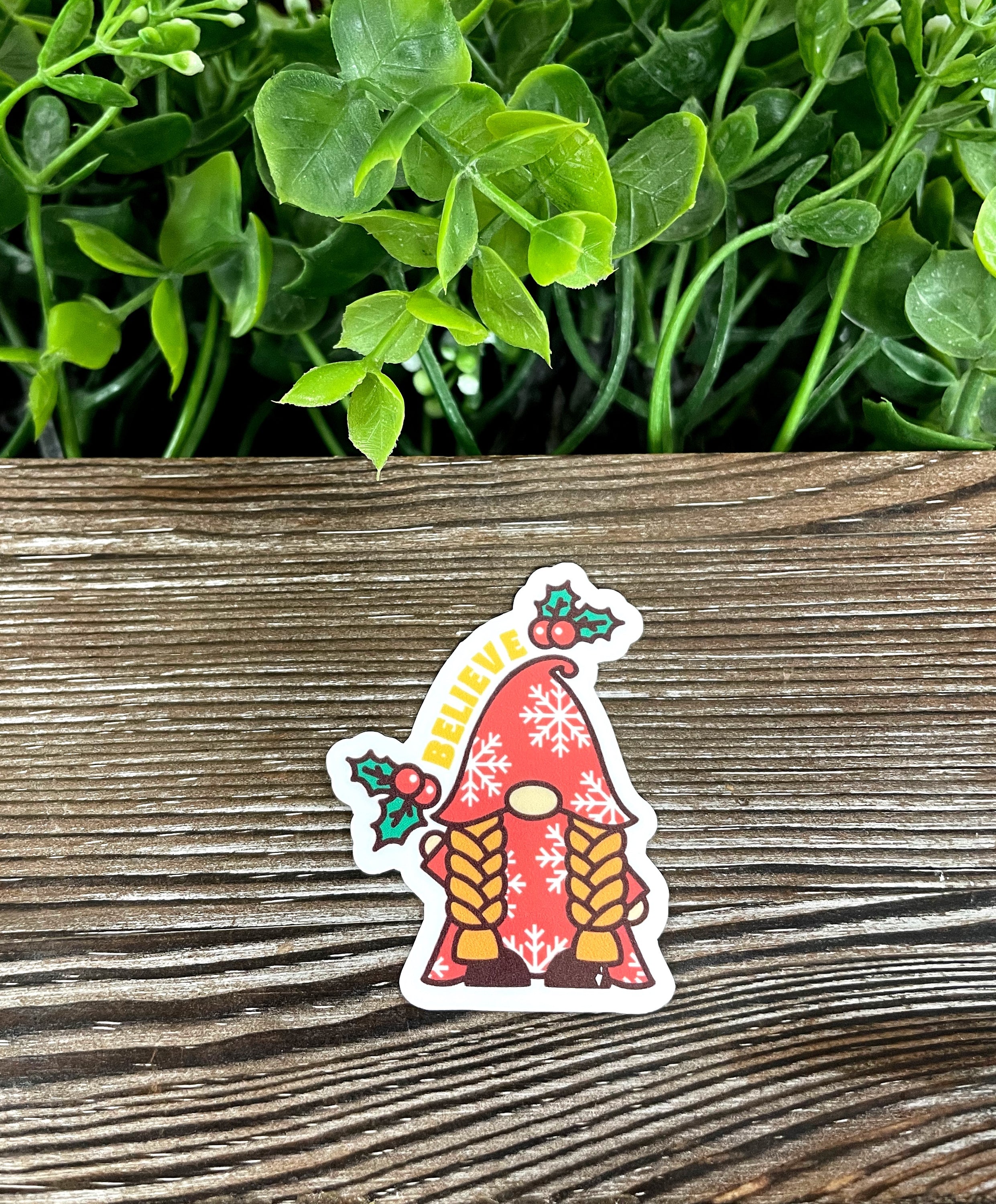 Christmas Mistletoe Gnome Believe Die Cut Vinyl Sticker featuring a whimsical gnome design with mistletoe.