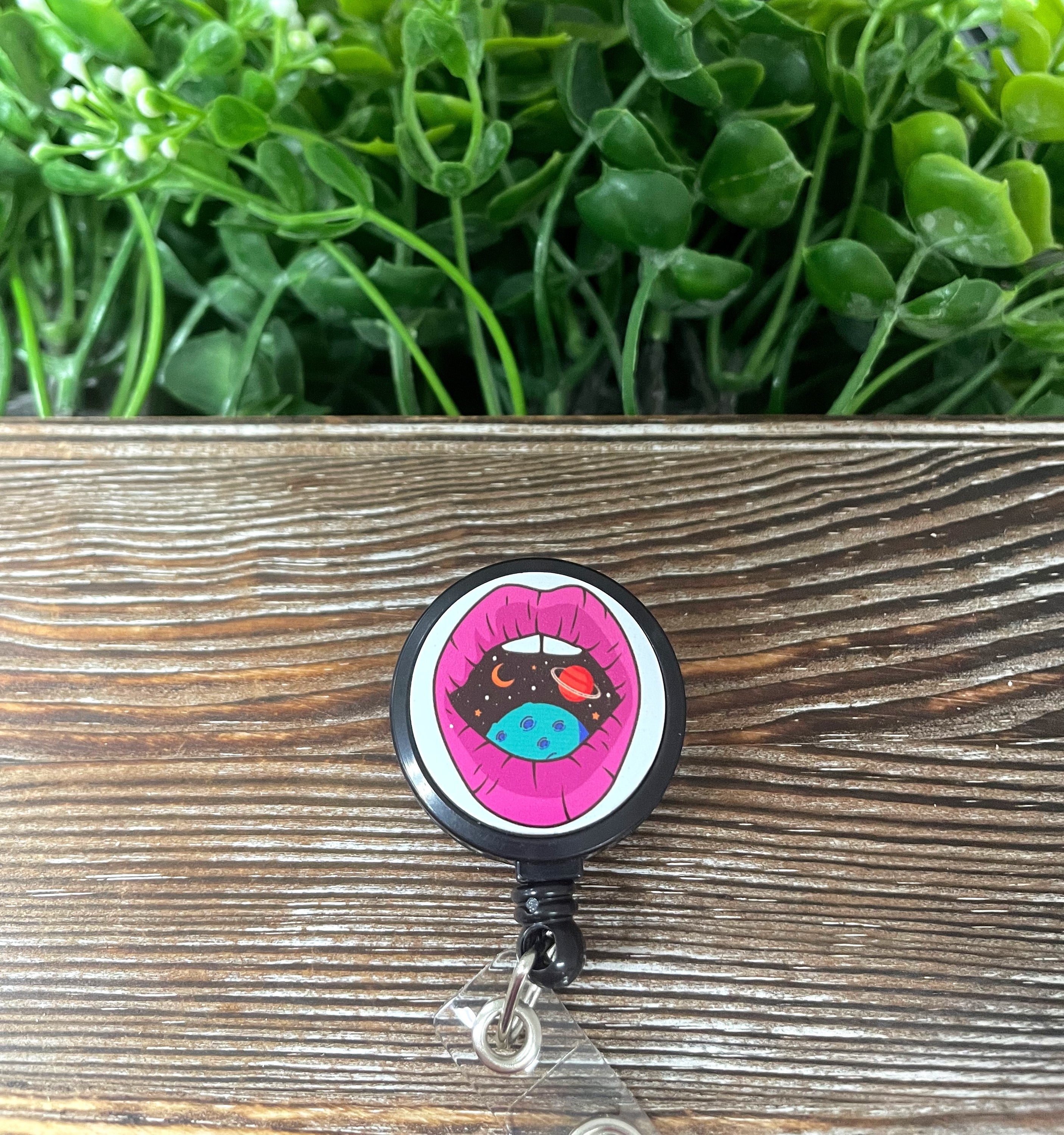 Cosmic Galaxy Mouth retractable badge reel featuring a vibrant galaxy design on a metal blank attached to a plastic reel.