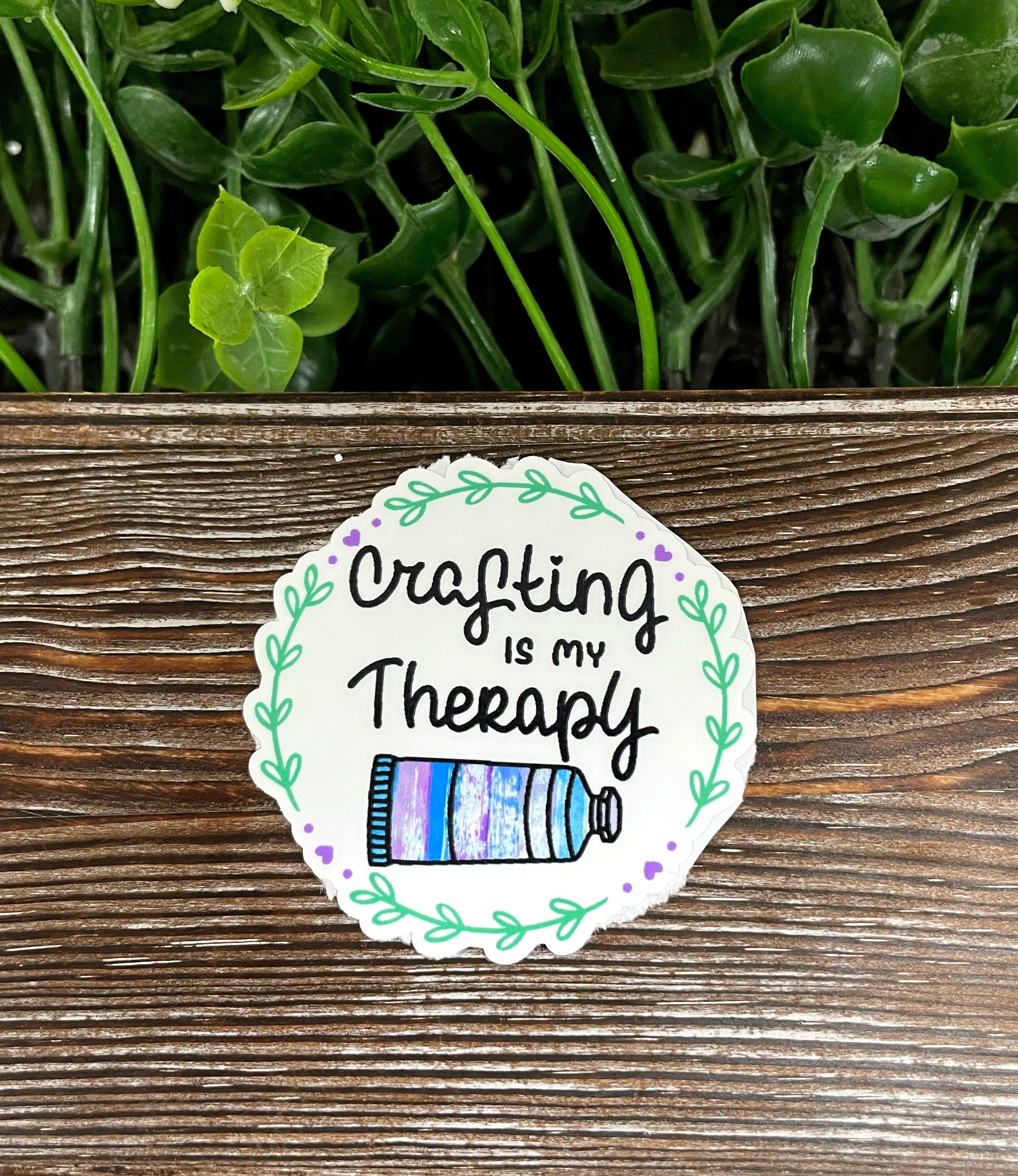 A vibrant 'Crafting is my Therapy' vinyl sticker displayed on a smooth surface, showcasing its colorful design and quality finish.