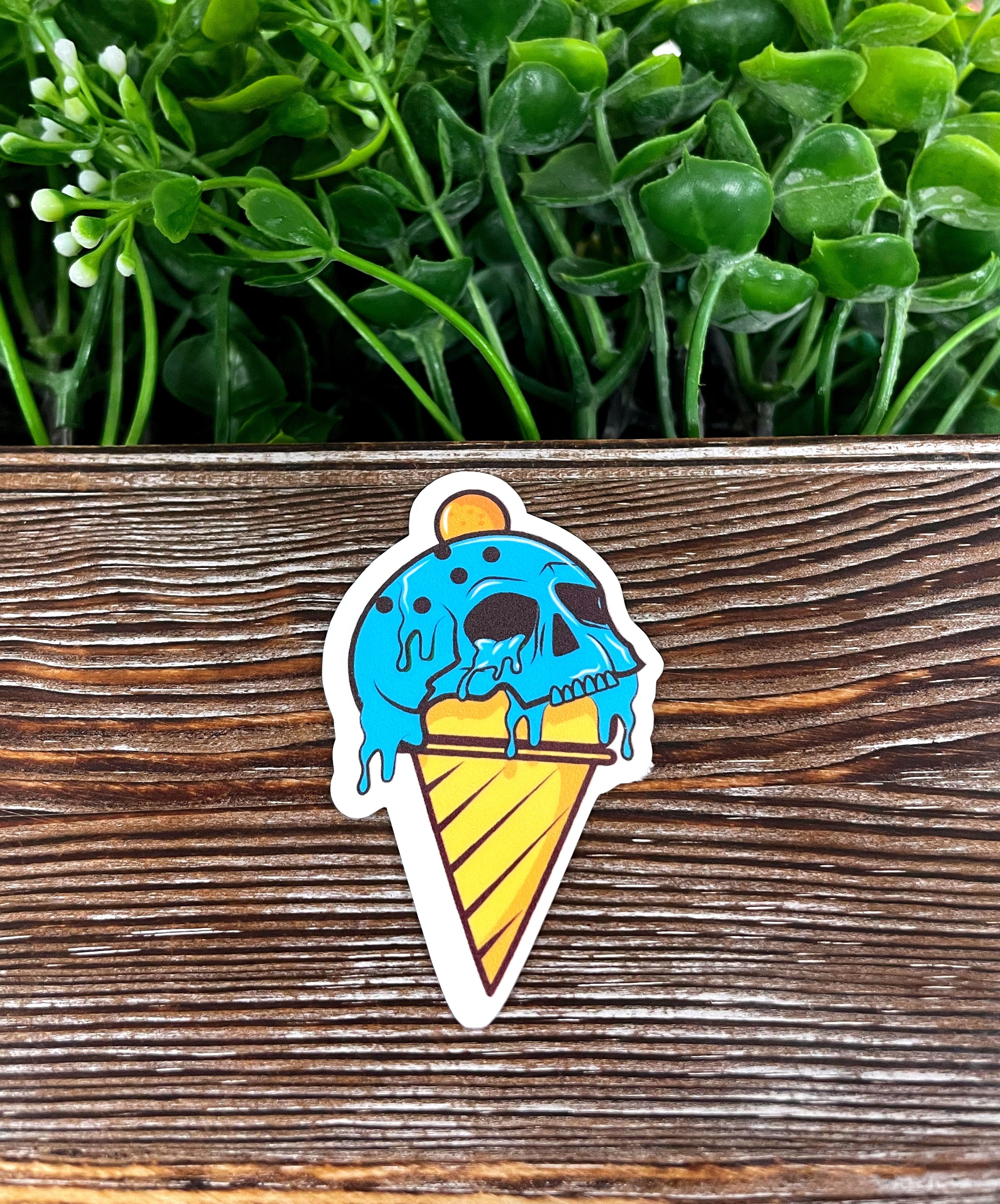 Creepy Skull Blue Ice Cream Cone die cut vinyl sticker featuring a playful skull design on an ice cream cone, perfect for personalizing items.