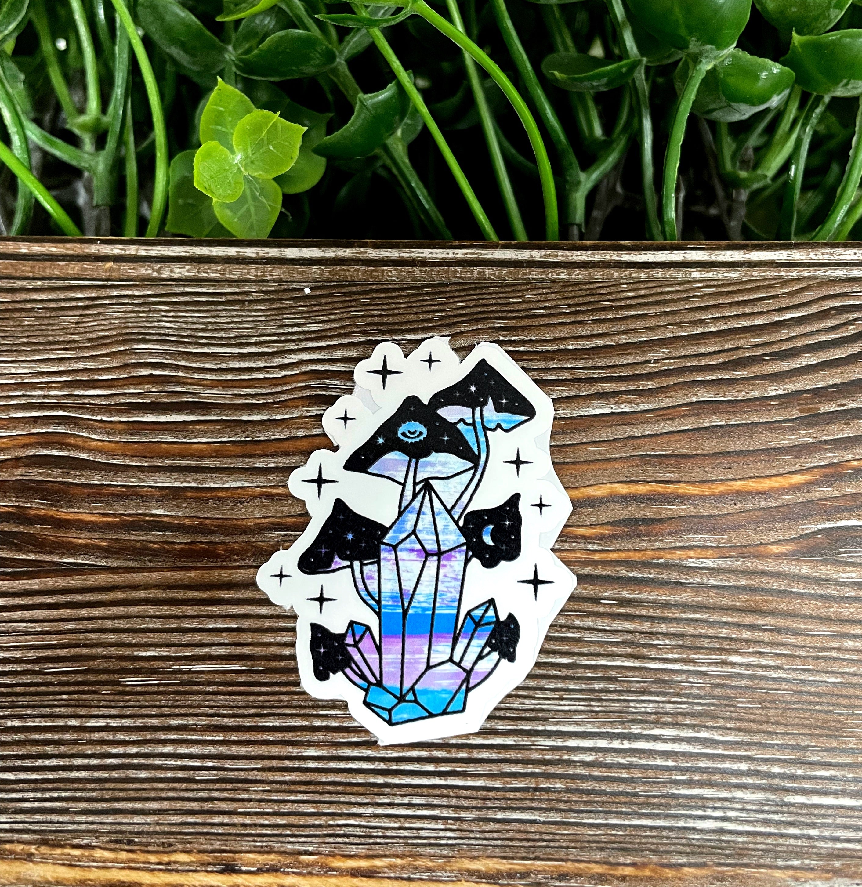 Colorful Crystal and Mushroom Sticker on a smooth surface, showcasing vibrant graphic art.