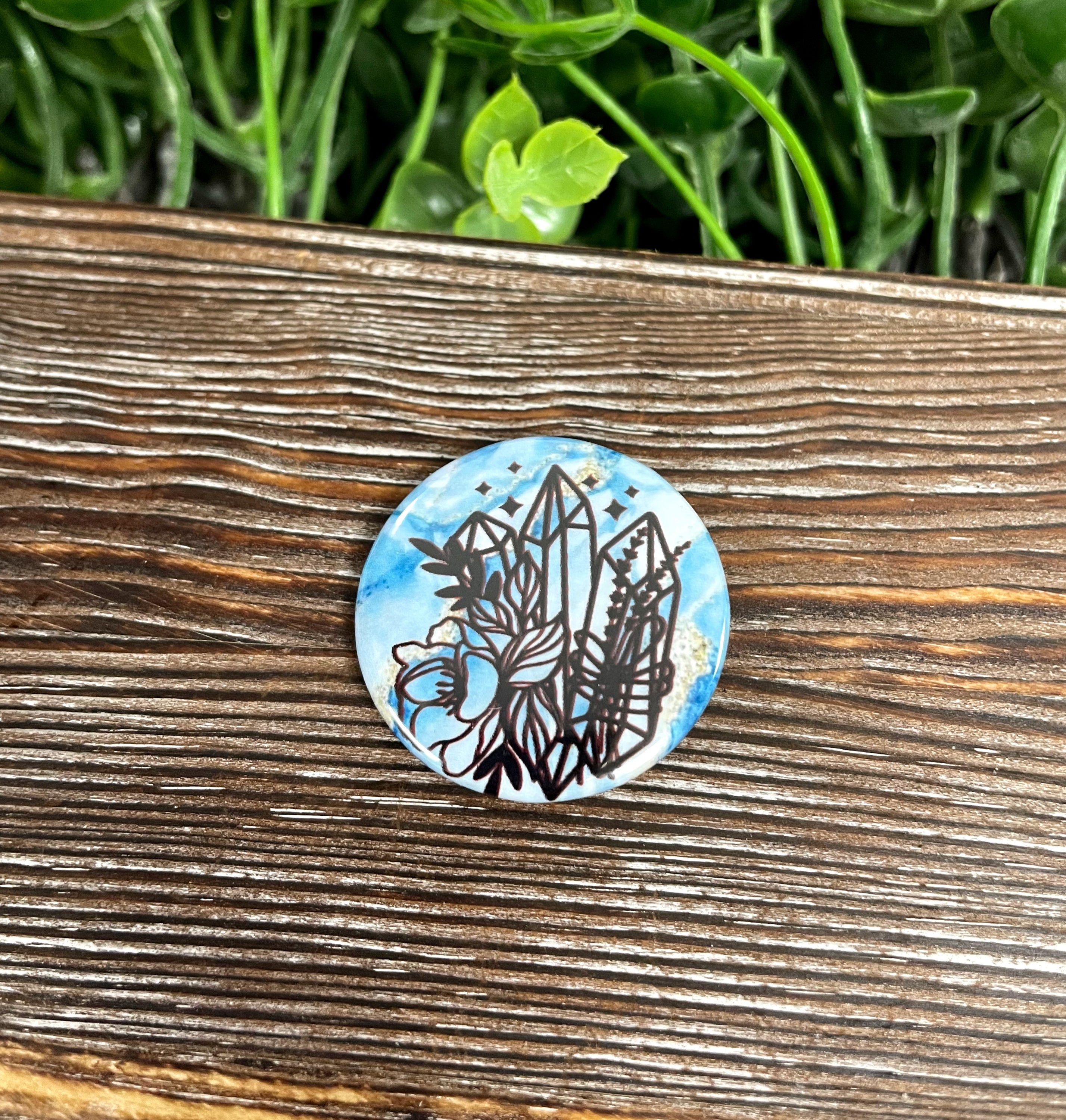 Crystal Bundle Blue Marble Graphic Art Button, 1.25 inches, featuring a vibrant blue marble design on a plastic back.