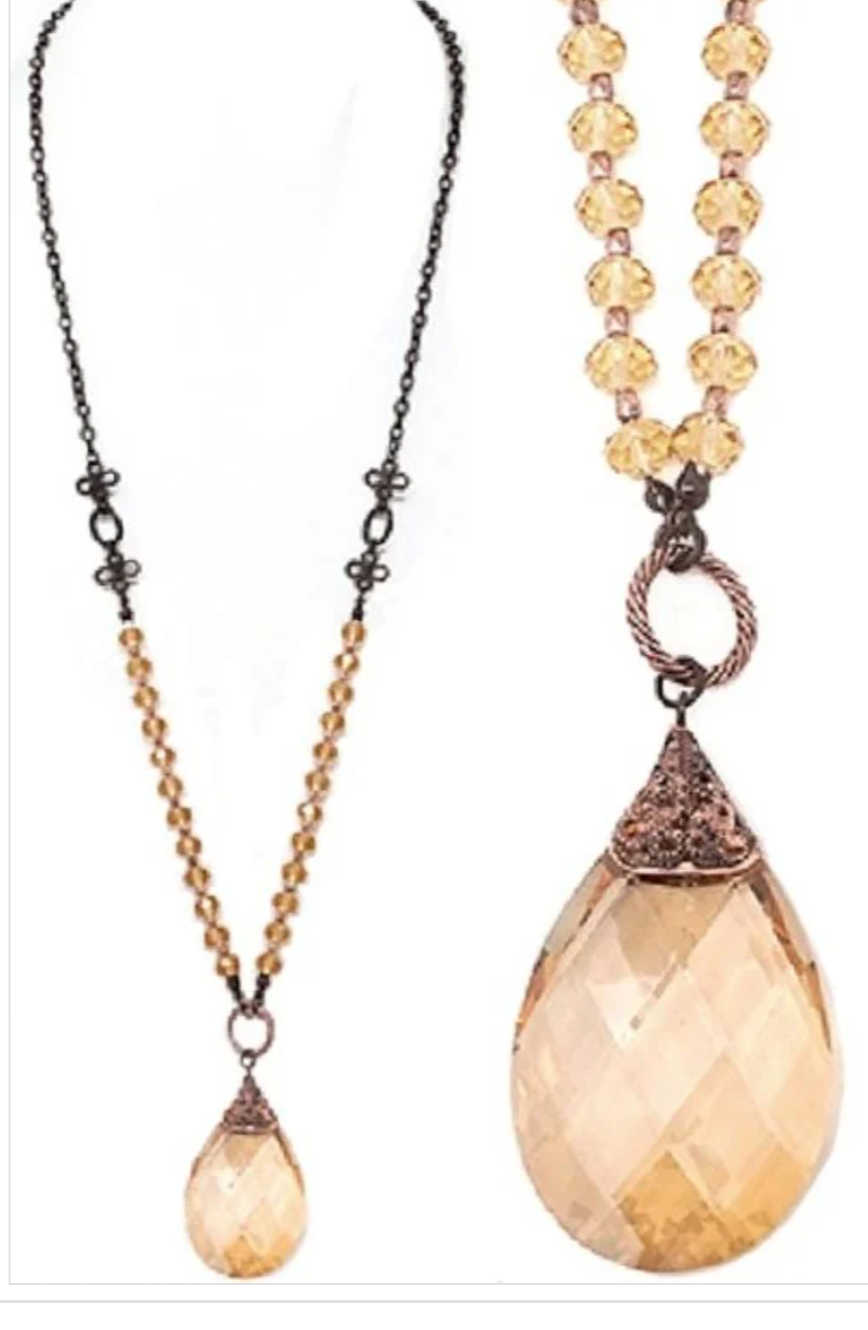 Elegant crystal teardrop necklace featuring glass crystal beads, showcasing a vintage design with a lobster claw closure.