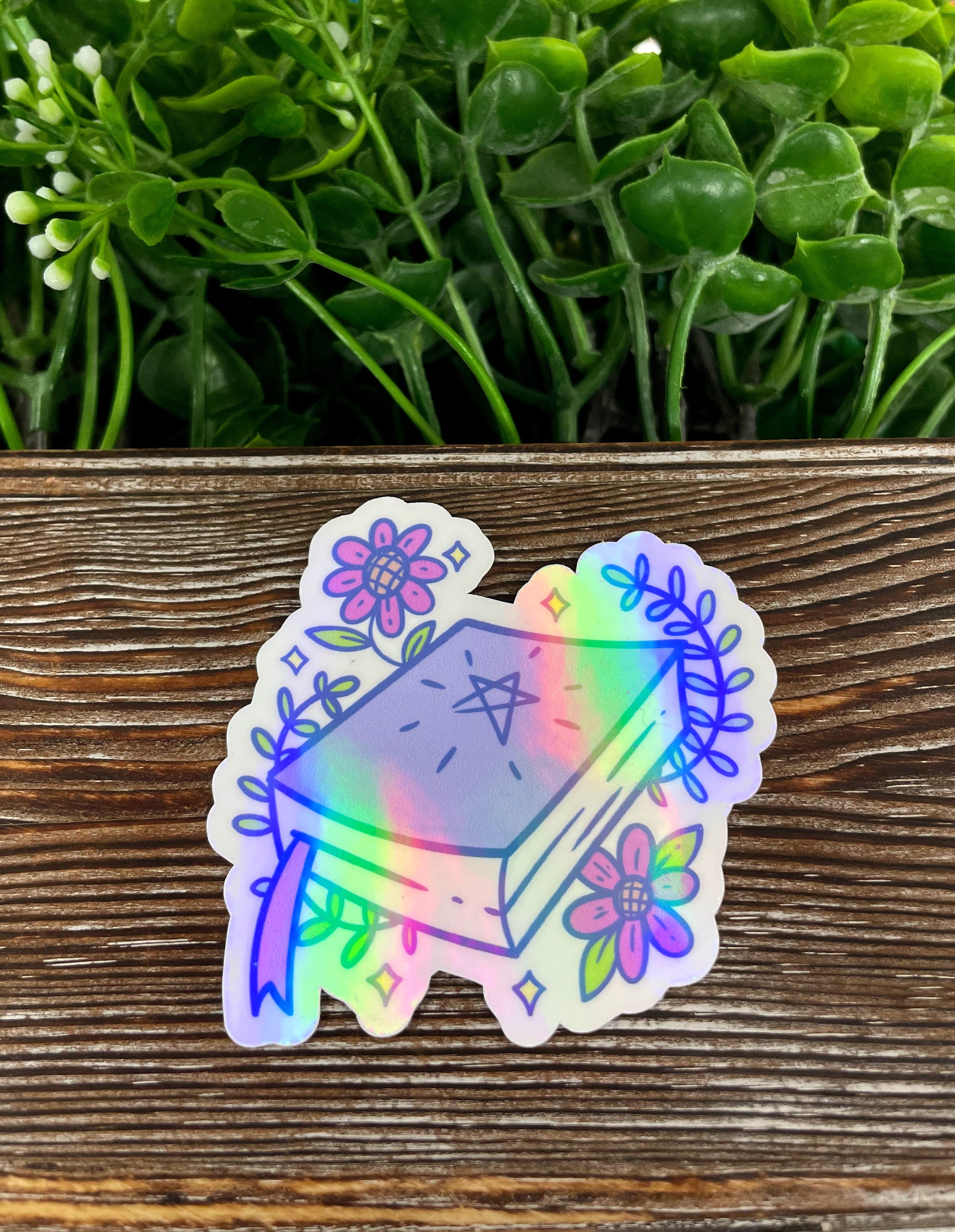 Cute Magic Spellbook die cut sticker on a smooth surface, showcasing vibrant colors and intricate graphic art design.