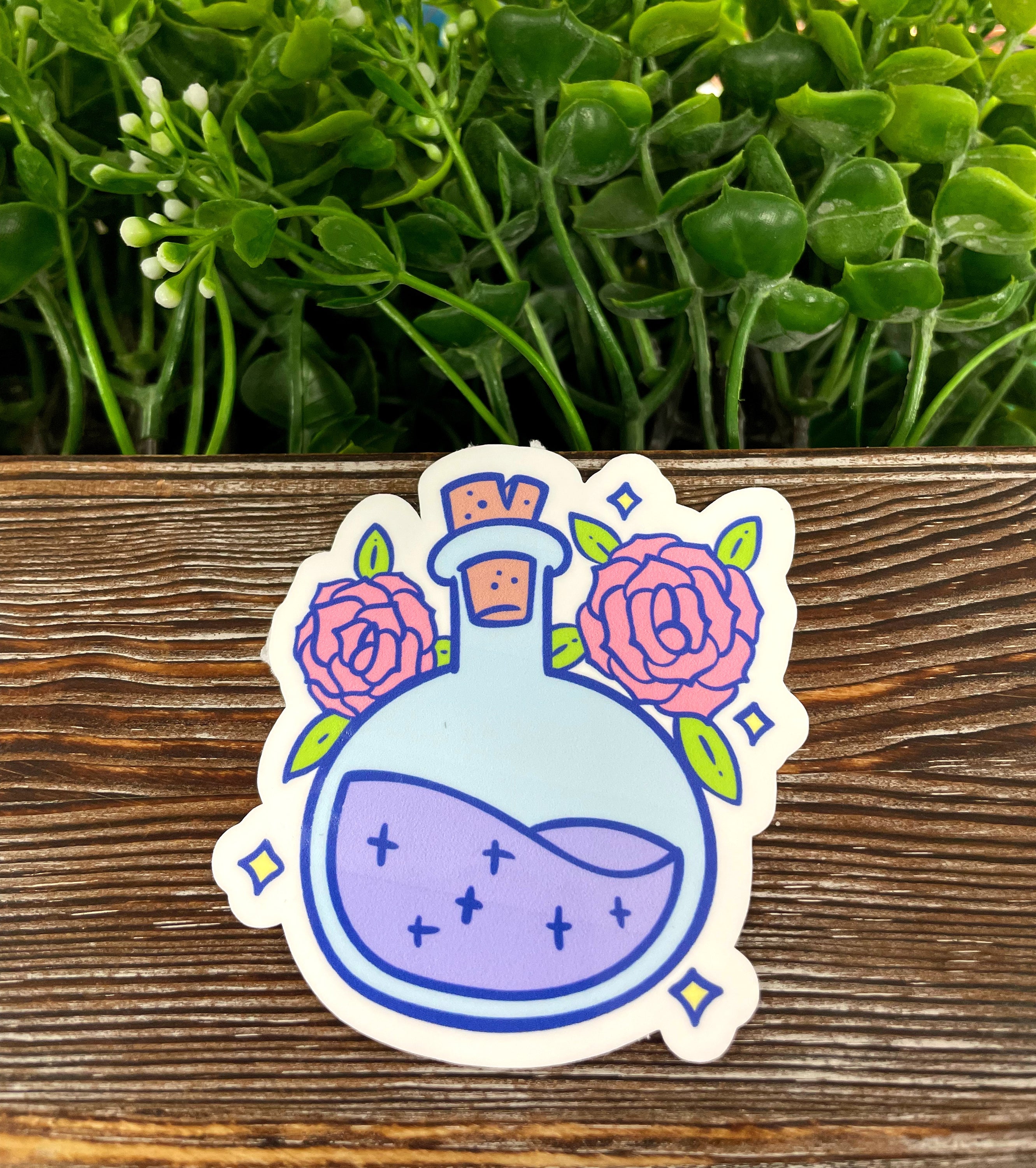 Cute pastel potion bottle die cut sticker on a smooth surface, showcasing vibrant colors and artistic design.