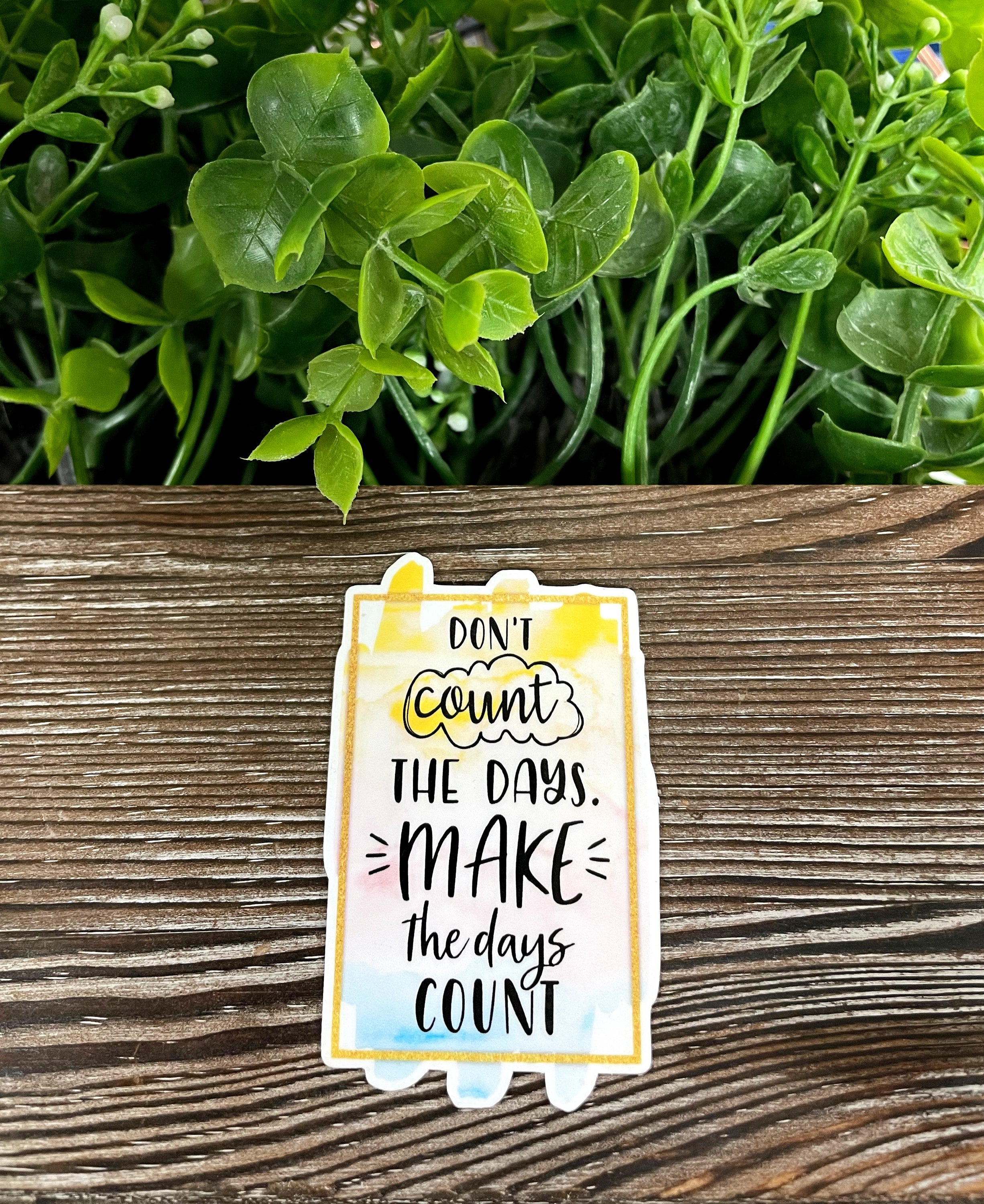 Boho die cut vinyl sticker with the phrase 'Don't Count the Days Make the Days Count', featuring vibrant colors and a stylish design.