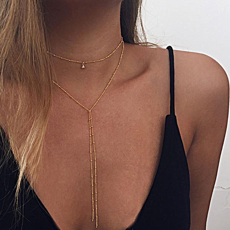 A stylish Double Lariat Choker Necklace made of high-quality zinc alloy, featuring a unique double lariat design and adjustable length.