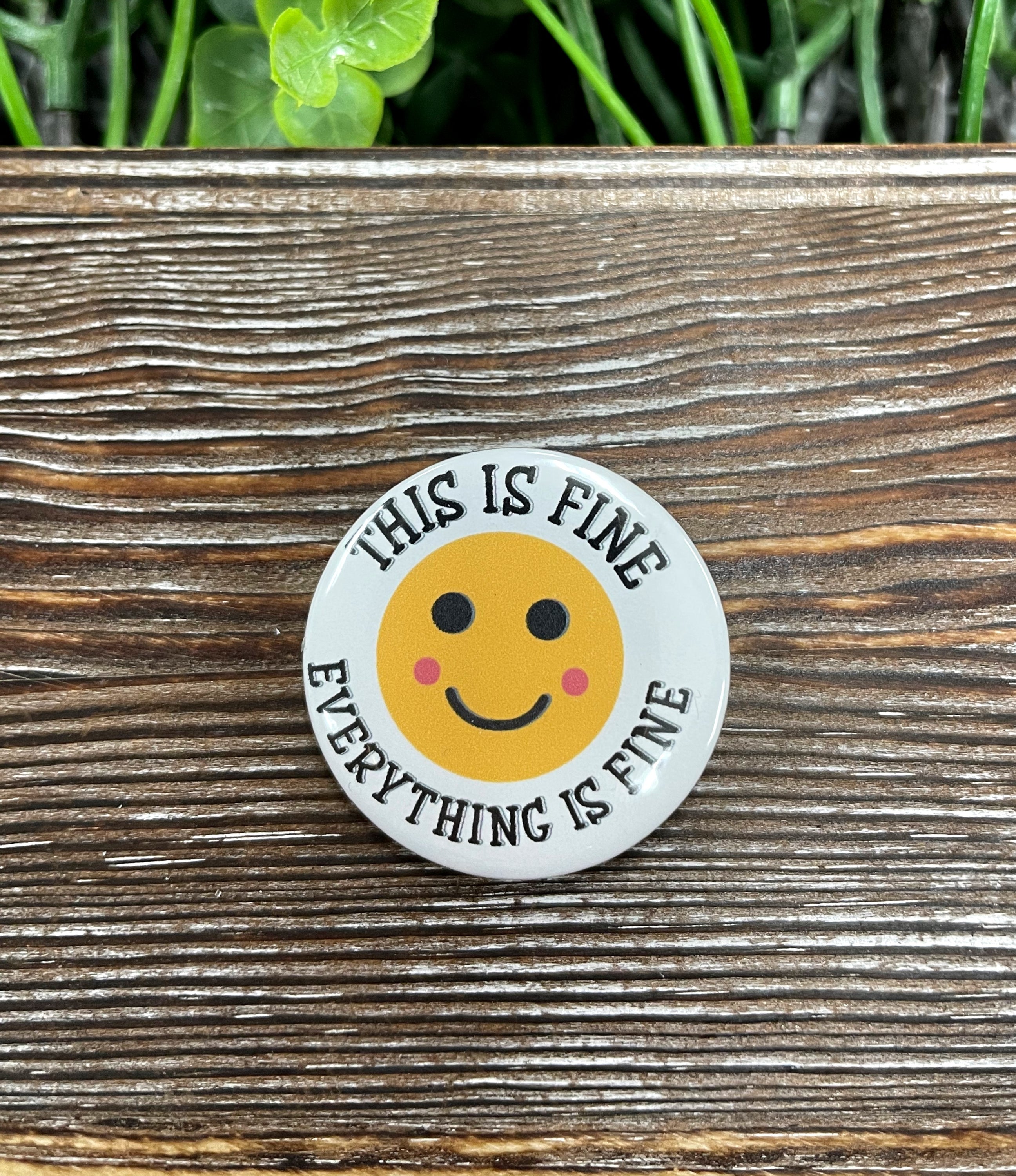 Everything is Fine Graphic Art Button, 1.25 inches, featuring vibrant colors and a durable plastic back, ideal for personal expression.